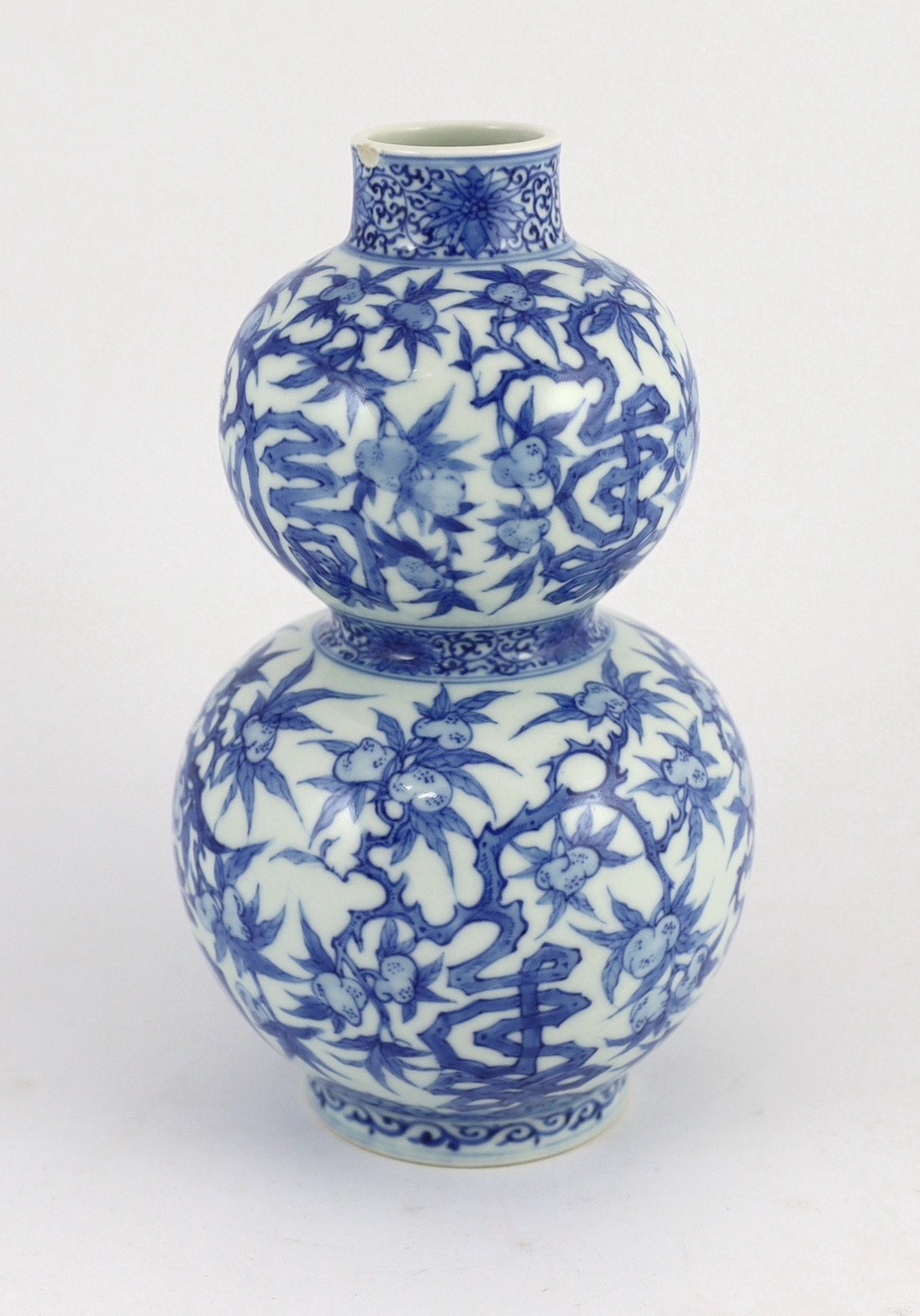 A Chinese blue and white 'fu lu shou' double gourd vase, Wanli mark probably late 19th century, 22cm high, splinter chip to rim and hairline crack to neck